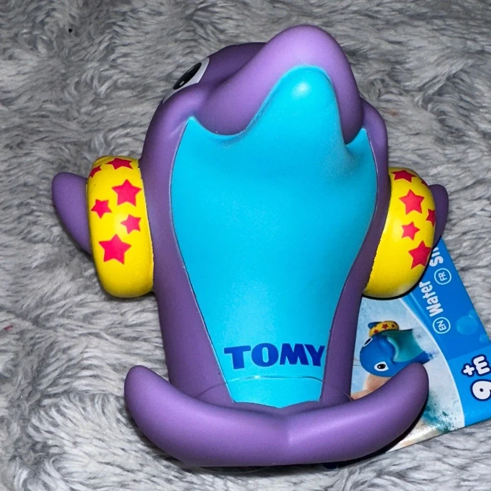 TOMY Water Whistlers Purple Dolphin Bath Toy E72379 Squirter Whistle 9m+